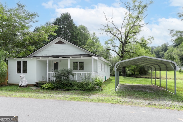 view of front of house with a porch, a carport, and a front yard