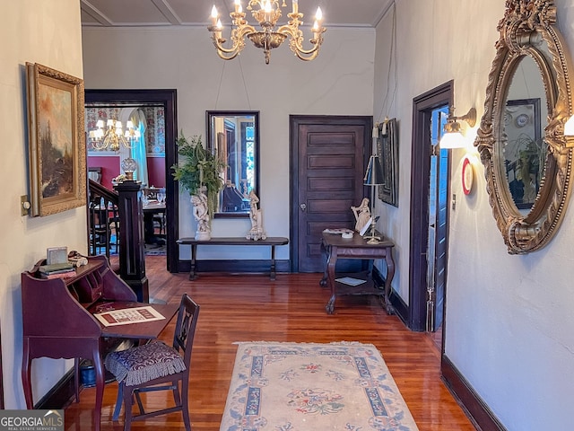 entrance foyer with a notable chandelier and dark hardwood / wood-style floors