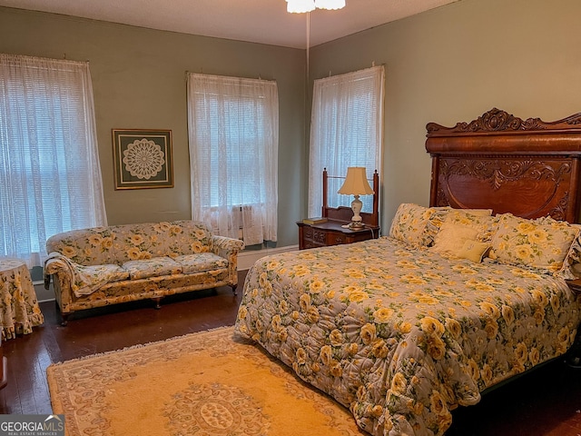 bedroom featuring dark hardwood / wood-style flooring