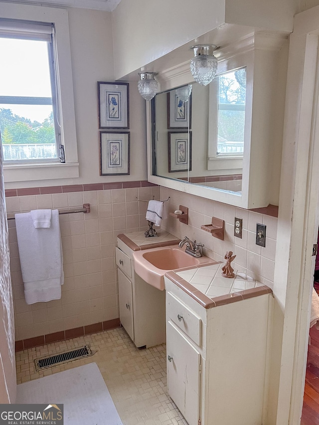 bathroom featuring vanity, tile walls, and tile patterned floors