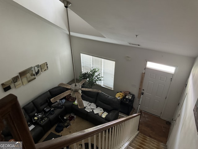 living room featuring hardwood / wood-style flooring and vaulted ceiling