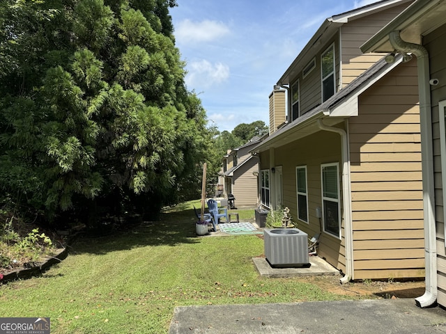 view of yard with central AC unit