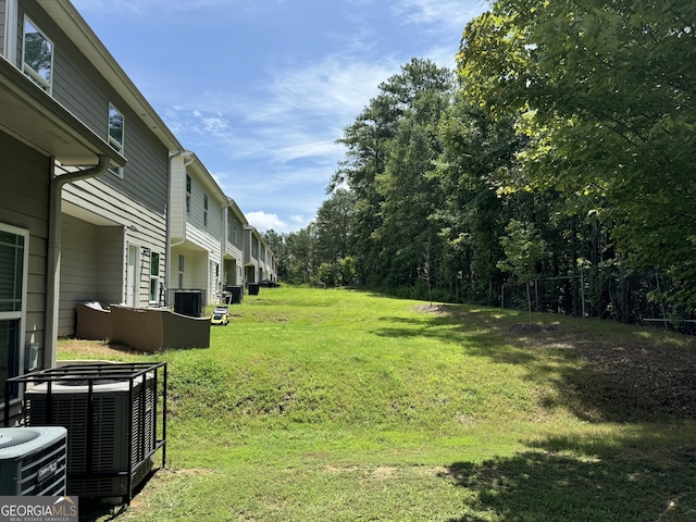 view of yard featuring central AC unit