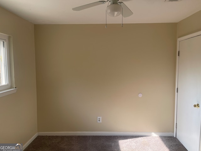 carpeted empty room featuring ceiling fan