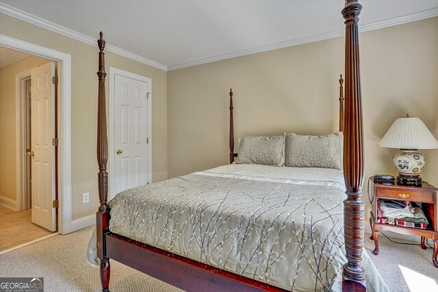 carpeted bedroom featuring ornamental molding