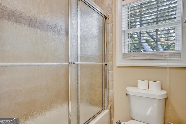 bathroom with toilet and plenty of natural light