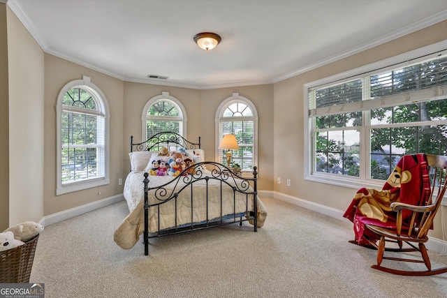 bedroom featuring crown molding and light colored carpet