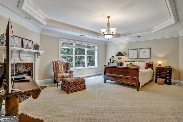 carpeted bedroom featuring ornamental molding, a chandelier, a high end fireplace, and a tray ceiling