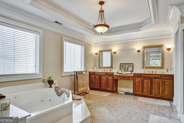 bathroom featuring dual vanity, a wealth of natural light, crown molding, and a tray ceiling