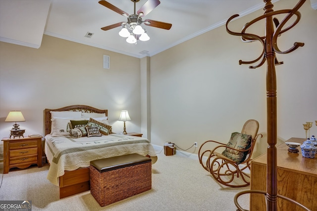 carpeted bedroom featuring ornamental molding and ceiling fan