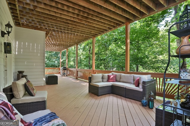 wooden terrace featuring outdoor lounge area