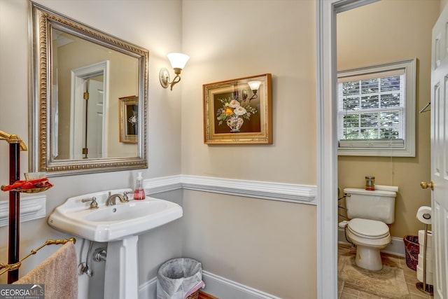 bathroom with tile patterned flooring and toilet