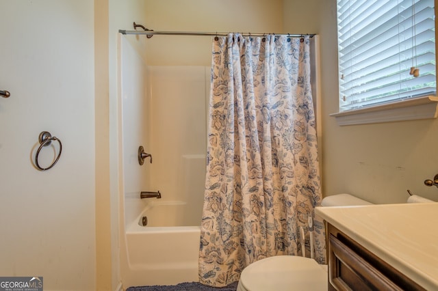 full bathroom with shower / bath combination with curtain, toilet, and vanity