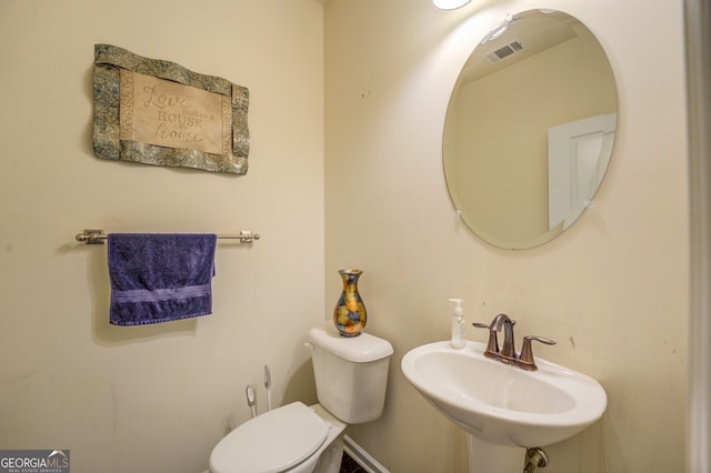 bathroom featuring sink and toilet