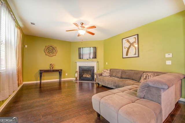 445 Brickstone Way, Covington, GA 30016 - living area with ceiling fan, dark wood-type flooring, and a high end fireplace