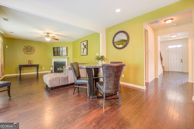445 Brickstone Way, Covington, GA 30016 - dining room with a ceiling fan, dark wood-style floors, a glass covered fireplace, and recessed lighting
