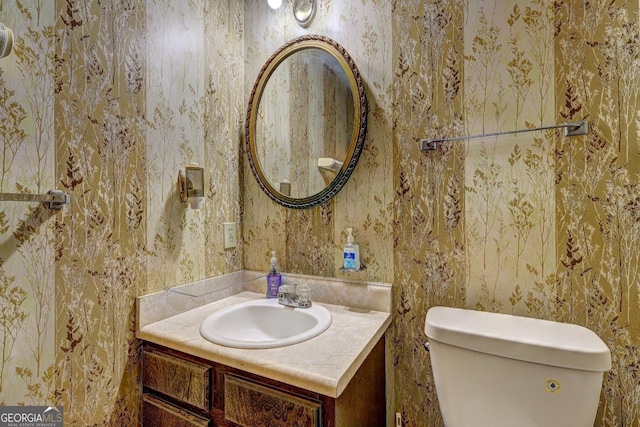 bathroom with vanity and toilet