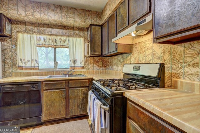 kitchen with dark brown cabinetry, stainless steel range with gas cooktop, dishwasher, and sink