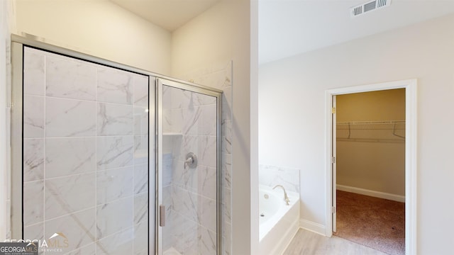 bathroom with independent shower and bath