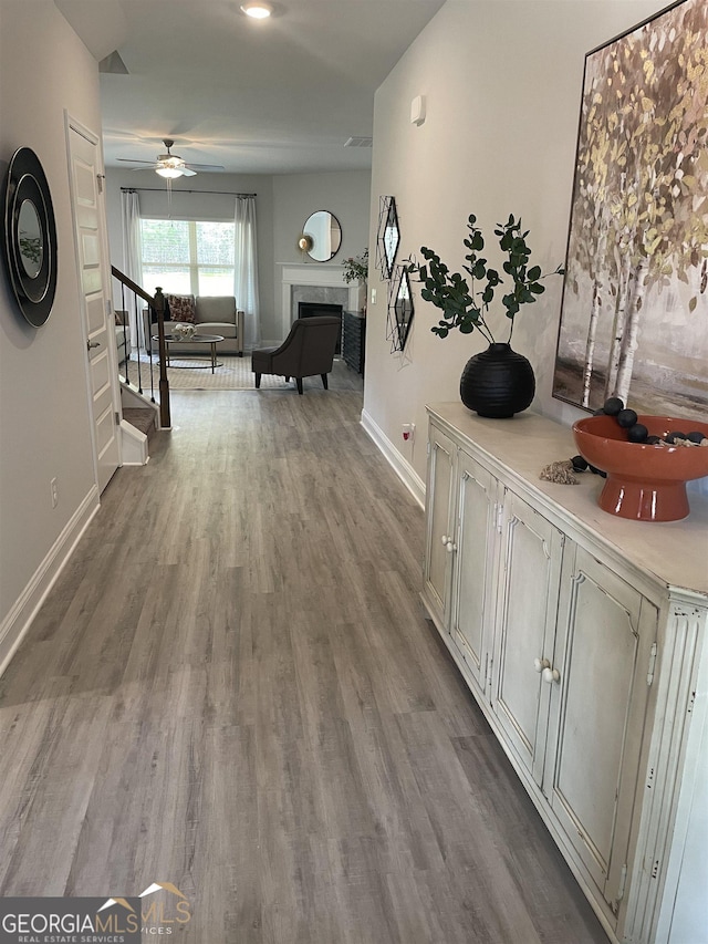 corridor featuring hardwood / wood-style floors