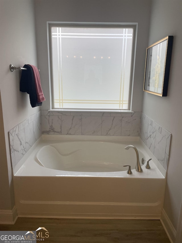 bathroom featuring a tub to relax in