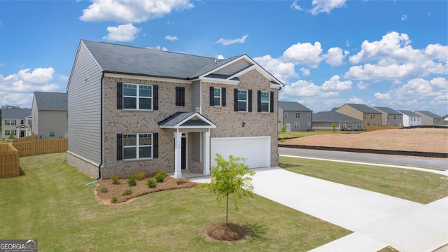 view of front facade featuring a garage and a front lawn