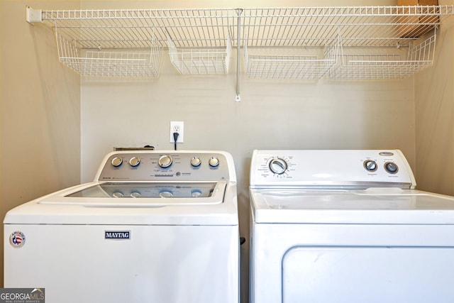 laundry area with washing machine and dryer