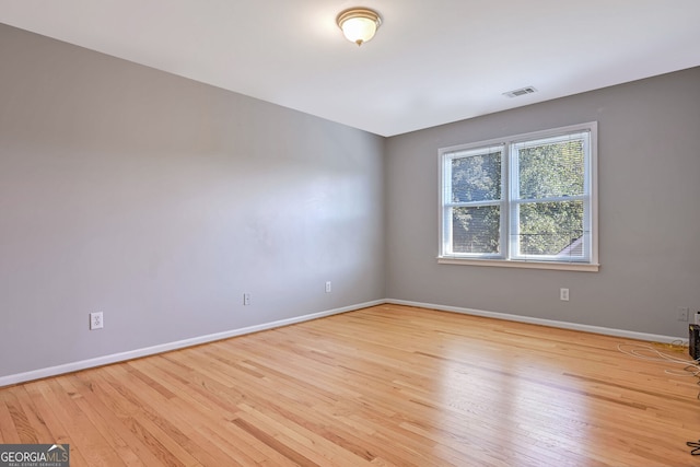 empty room with light hardwood / wood-style floors