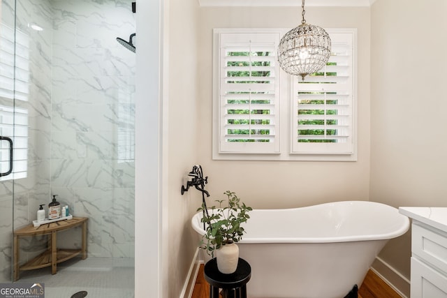 bathroom featuring vanity, shower with separate bathtub, and plenty of natural light