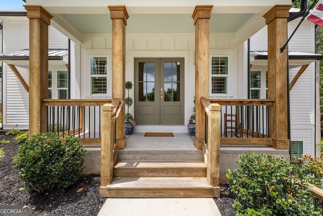 view of exterior entry with covered porch