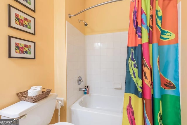 bathroom with shower / tub combo with curtain and toilet