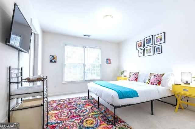 bedroom with light carpet