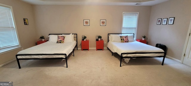 bedroom with light colored carpet