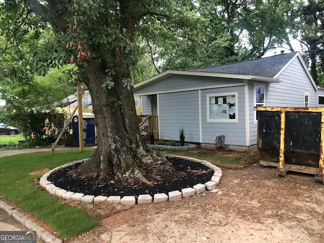 view of home's exterior with a playground