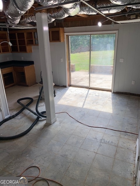 basement featuring tile patterned flooring