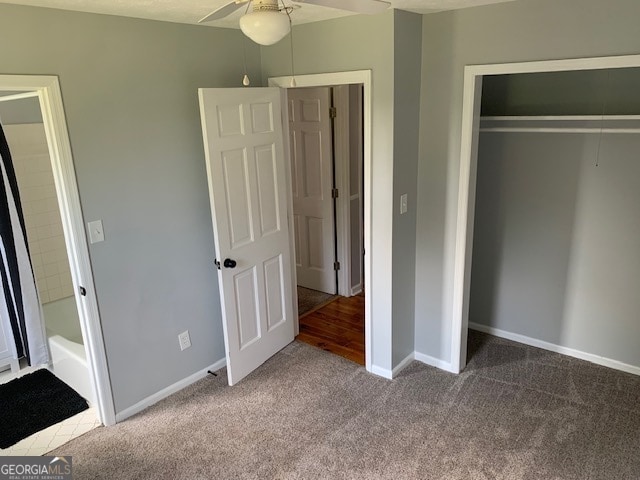 unfurnished bedroom featuring ceiling fan, carpet, and a closet