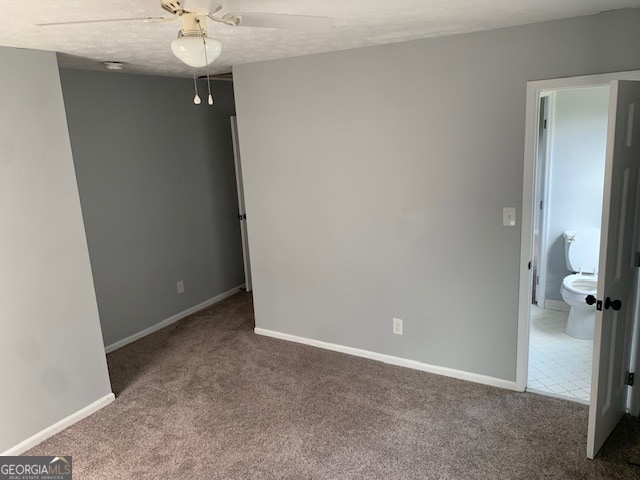 tiled empty room with ceiling fan