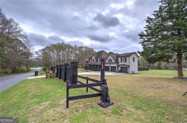 view of front of home with a garage and a front yard