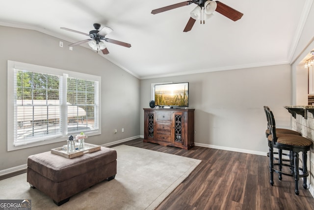 living room with ceiling fan, hardwood / wood-style flooring, lofted ceiling, and ornamental molding