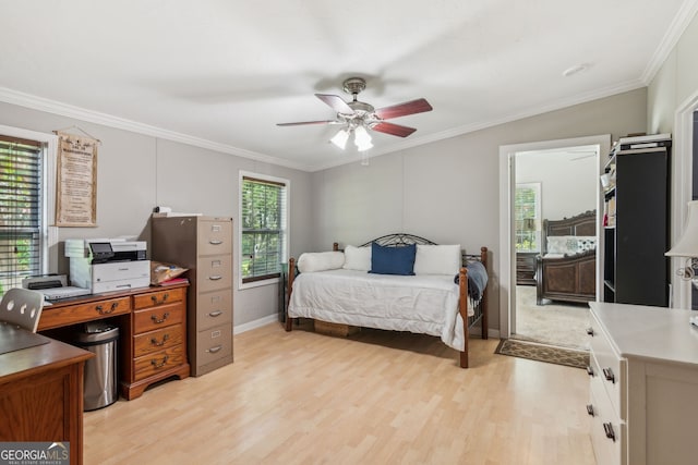 bedroom with ceiling fan, crown molding, and light hardwood / wood-style floors