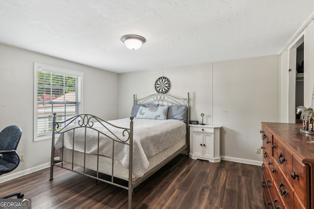 bedroom with hardwood / wood-style floors