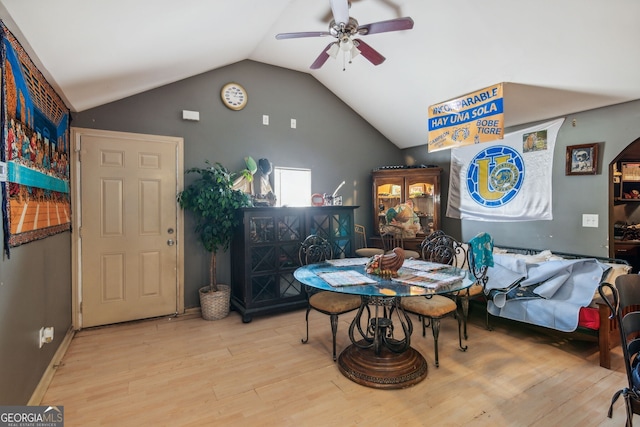 bedroom with ceiling fan, light hardwood / wood-style floors, and lofted ceiling