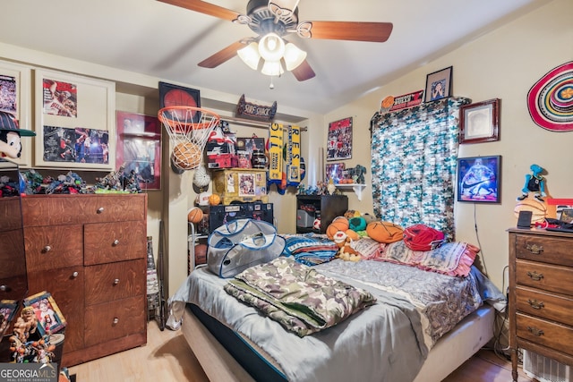 bedroom featuring ceiling fan and wood-type flooring