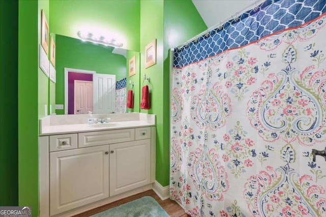 full bath featuring a shower with curtain and vanity