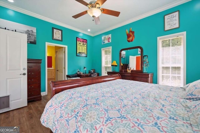 bedroom with crown molding, hardwood / wood-style floors, and ceiling fan