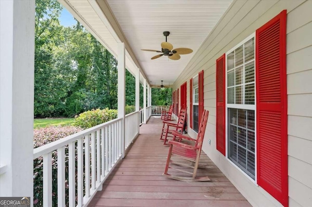 wooden deck featuring ceiling fan and a porch