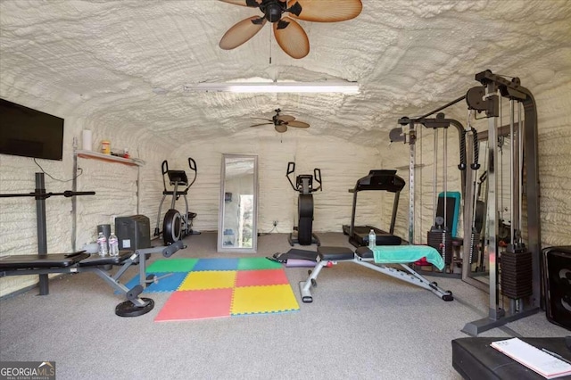 workout area featuring carpet floors, ceiling fan, and lofted ceiling