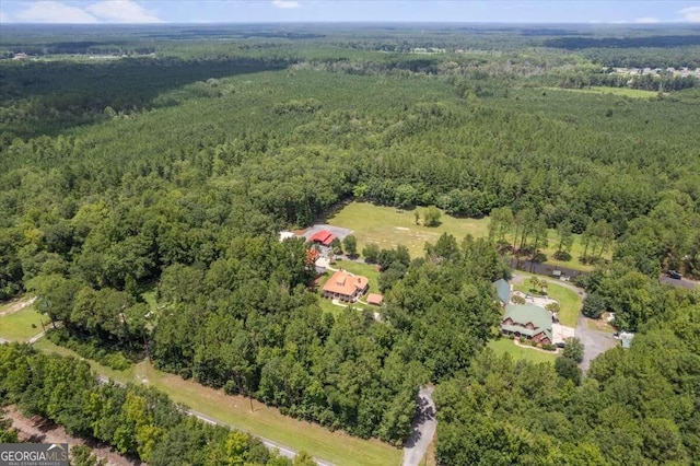 bird's eye view featuring a forest view