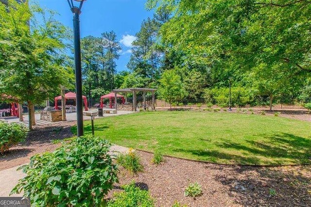 view of yard with a pergola