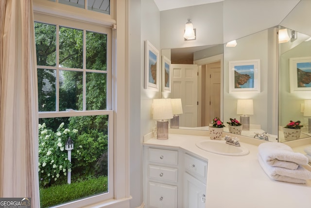 bathroom featuring vanity and plenty of natural light